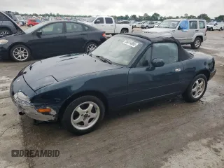 1996 Mazda MX-5 Miata z VIN JM1NA3531T0718068, wystawiony jako Copart lot #56614065 z przebiegiem 116 486 mil mil oraz Szkody całkowita. Historia ofert i sprzedaży dostępna na DreamBid. Obrazek 1.