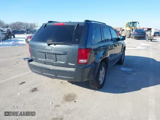 2007 Jeep Grand Cherokee Laredo with VIN 1J8GS48K97C538509, listed as a IAAI auction lot 41605236 with 164,530 mi miles. Bid and sale history available at carsss.com. Image 4.