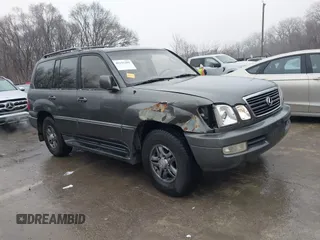 2002 Lexus LX 470 with VIN JTJHT00W923515897, listed as a IAAI auction lot 41155492 with 244,619 mi miles. Bid and sale history available at carsss.com. Image 1.