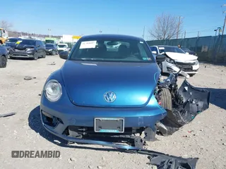 2018 Volkswagen Beetle S z VIN 3VWFD7ATXJM711734, wystawiony jako IAAI lot #41704497 z przebiegiem 66 702 mil mil oraz . Historia ofert i sprzedaży dostępna na DreamBid. Obrazek 12.