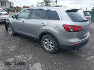 2015 Mazda CX-9 Sport with VIN JM3TB3BV2F0454770, listed as a IAAI auction lot 42009879 with 98,916 mi miles and . Bid and sale history available at carsss.com. Image 3.