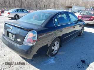 2003 Nissan Altima S with VIN 1N4AL11D33C320084, listed as a IAAI auction lot 41849903 with 212,137 mi miles. Bid and sale history available at carsss.com. Image 4.