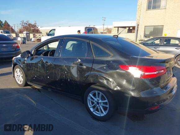 2015 Ford Focus SE with VIN 1FADP3F29FL350473, listed as a IAAI auction lot 41032182 with 102,898 mi miles. Bid and sale history available at carsss.com. Image 3.