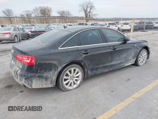 2013 Audi A6 3.0T Prestige with VIN WAUHGAFC3DN061788, listed as a IAAI auction lot 41129245 with 137,575 mi miles. Bid and sale history available at carsss.com. Image 4.
