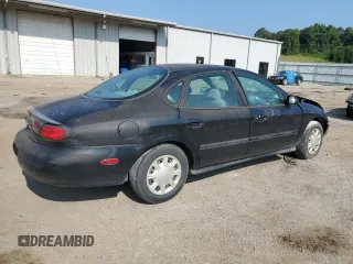 1998 Ford Taurus LX z VIN 1FAFP52U9WA174855, wystawiony jako Copart lot #66728184 z przebiegiem 104 796 mil mil oraz Szkody całkowita. Historia ofert i sprzedaży dostępna na DreamBid. Obrazek 3.