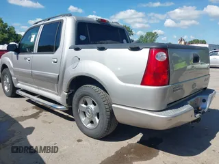 2005 Ford Explorer Sport Trac XLS z VIN 1FMZU67K25UB40598, wystawiony jako IAAI lot #42700021 z przebiegiem 201 596 mil mil oraz . Historia ofert i sprzedaży dostępna na DreamBid. Obrazek 3.