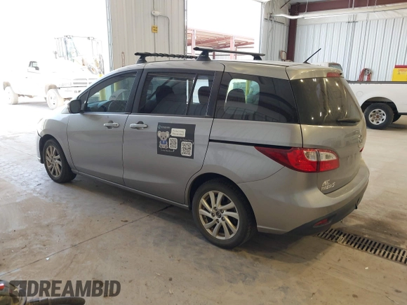 2015 Mazda 5 Sport with VIN JM1CW2BL0F0185433, listed as a IAAI auction lot 42594468 with 189,696 mi miles and . Bid and sale history available at DreamBid. Image 3.