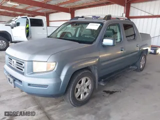 2006 Honda Ridgeline RTL with VIN 2HJYK16516H511027, listed as a IAAI auction lot 42052394 with 354,106 mi miles. Bid and sale history available at carsss.com. Image 2.