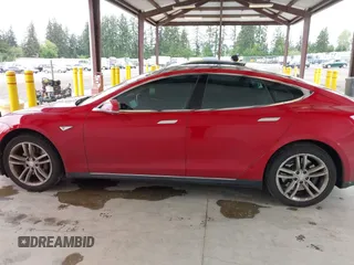 2013 Tesla Model S with VIN 5YJSA1CN7DFP26996, listed as a IAAI auction lot 42244540 with 128,160 mi miles and . Bid and sale history available at DreamBid. Image 14.