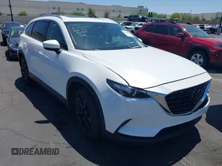 2023 Mazda CX-9 Touring Plus with VIN JM3TCBAY7P0636047, listed as a IAAI auction lot 42309618 with 20,821 mi miles and . Bid and sale history available at DreamBid. Image 1.