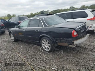 2004 Jaguar XJ VDP with VIN SAJWA74C64SG27143, listed as a Copart auction lot 71373744 with 129,942 mi miles and Salvage Title. Bid and sale history available at carsss.com. Image 2.