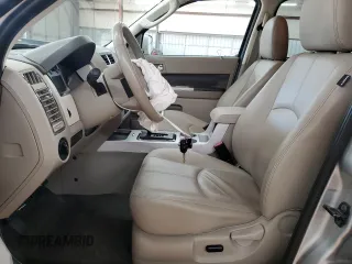 2009 Mercury Mariner Premier z VIN 4M2CU87GX9KJ17731, wystawiony jako Copart lot #54204855 z przebiegiem 54 521 mil mil oraz Szkody całkowita. Historia ofert i sprzedaży dostępna na DreamBid. Obrazek 7.