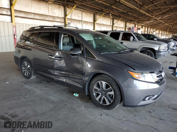 2014 Honda Odyssey Touring with VIN 5FNRL5H99EB111525, listed as a Copart auction lot 61986005 with 137,905 mi miles and Salvage title. Bid and sale history available at DreamBid. Image 4.