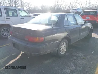 1996 Toyota Camry DX with VIN JT2BG12KXT0407961, listed as a IAAI auction lot 41511138 with 266,781 mi miles. Bid and sale history available at carsss.com. Image 4.