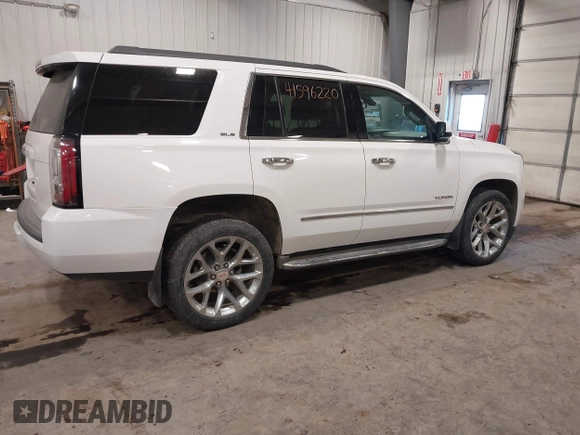 2015 GMC Yukon SLE with VIN 1GKS2AKC6FR103447, listed as a IAAI auction lot 41596220 with 104,209 mi miles. Bid and sale history available at carsss.com. Image 4.