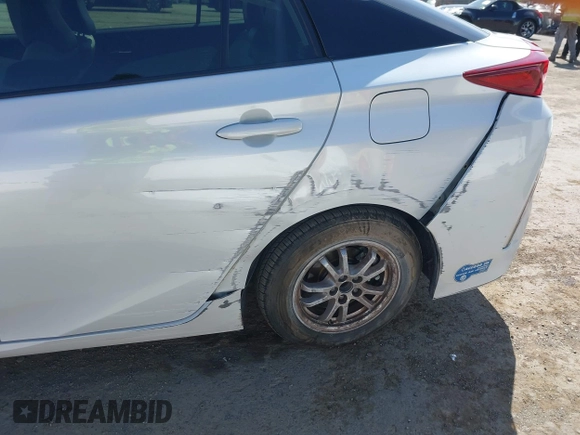2021 Toyota Prius LE with VIN JTDKAMFP2M3177459, listed as a IAAI auction lot 42093828 with 65,501 mi miles and . Bid and sale history available at DreamBid. Image 6.