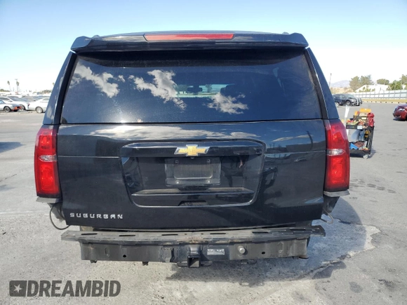 2017 Chevrolet Suburban LS with VIN 1GNSCGECXHR351539, listed as a Copart auction lot 87070214 with 246,129 mi miles and Salvage title. Bid and sale history available at DreamBid. Image 6.