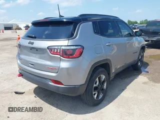 2018 Jeep Compass Trailhawk with VIN 3C4NJDDB2JT198784, listed as a IAAI auction lot 42405539 with 121,553 mi miles and . Bid and sale history available at DreamBid. Image 4.