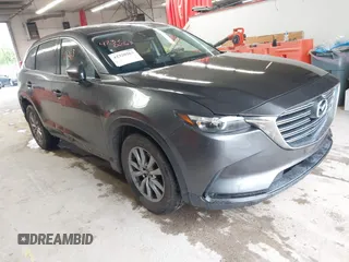 2017 Mazda CX-9 Touring z VIN JM3TCBCY1H0127229, wystawiony jako IAAI lot #42320263 z przebiegiem 85 890 mil mil oraz . Historia ofert i sprzedaży dostępna na DreamBid. Obrazek 1.