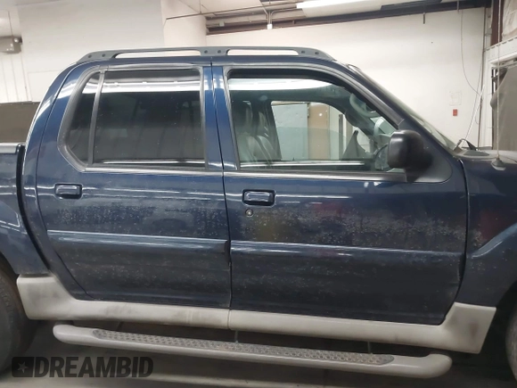 2003 Ford Explorer Sport Trac XLS z VIN 1FMDU77E03UC07089, wystawiony jako IAAI lot #41938966 z przebiegiem 128 982 mil mil oraz . Historia ofert i sprzedaży dostępna na DreamBid. Obrazek 13.