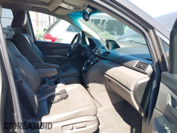 2012 Honda Odyssey EX-L with VIN 5FNRL5H65CB012428, listed as a IAAI auction lot 42164272 with 256,253 mi miles and . Bid and sale history available at carsss.com. Image 5.