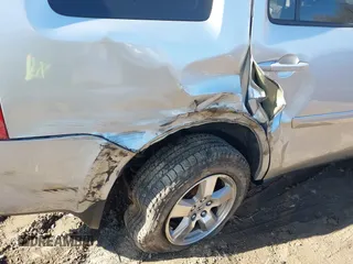 2009 Honda Pilot EX with VIN 5FNYF48479B002570, listed as a IAAI auction lot 41703942 with 146,405 mi miles. Bid and sale history available at carsss.com. Image 6.