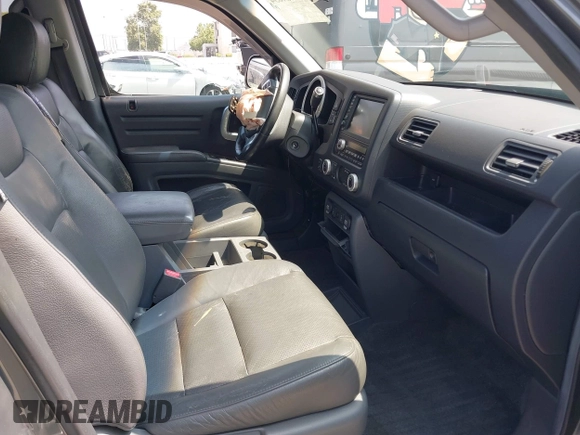 2007 Honda Ridgeline RTL with VIN 2HJYK16547H502601, listed as a IAAI auction lot 42484634 with 197,253 mi miles and . Bid and sale history available at DreamBid. Image 5.