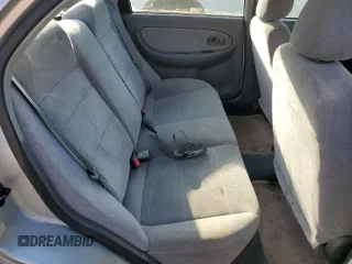 2001 Kia Sephia z VIN KNAFB121715014673, wystawiony jako Copart lot #71712174 z przebiegiem 83 277 mil mil oraz Szkody całkowita. Historia ofert i sprzedaży dostępna na DreamBid. Obrazek 10.