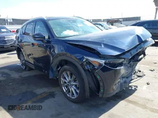 2020 Mazda CX-5 Grand Touring with VIN JM3KFADM6L1830093, listed as a IAAI auction lot 41699672 with 66,769 mi miles. Bid and sale history available at carsss.com. Image 1.