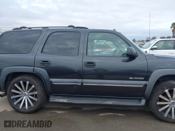 2003 Chevrolet Tahoe LS with VIN 1GNEC13T73R297770, listed as a IAAI auction lot 42071895 with 215,848 mi miles. Bid and sale history available at carsss.com. Image 14.