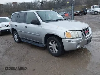 2006 GMC Envoy SLT with VIN 1GKDT13SX62342147, listed as a IAAI auction lot 40873738 with 159,092 mi miles. Bid and sale history available at carsss.com. Image 1.