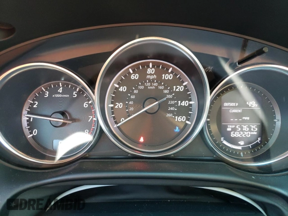 2014 Mazda CX-5 Touring z VIN JM3KE4CYXE0393443, wystawiony jako Copart lot #54738705 z przebiegiem 68 220 mil mil oraz Szkody całkowita. Historia ofert i sprzedaży dostępna na DreamBid. Obrazek 9.