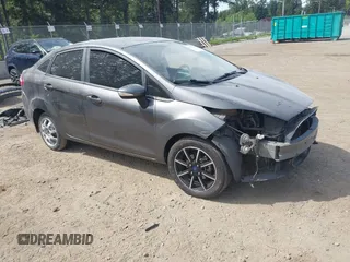2016 Ford Fiesta SE z VIN 3FADP4BJ5GM104717, wystawiony jako IAAI lot #42236073 z przebiegiem 174 858 mil mil oraz . Historia ofert i sprzedaży dostępna na DreamBid. Obrazek 1.