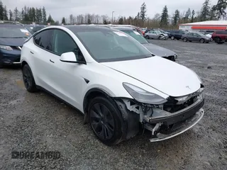 2025 Tesla Model Y Long Range with VIN 7SAYGDEDXSF248734, listed as a IAAI auction lot 41719195 with 5,876 mi miles and . Bid and sale history available at DreamBid. Image 1.