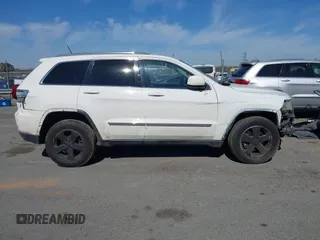 2012 Jeep Grand Cherokee Laredo with VIN 1C4RJFAT4CC229204, listed as a IAAI auction lot 41659491 with 141,143 mi miles. Bid and sale history available at carsss.com. Image 13.