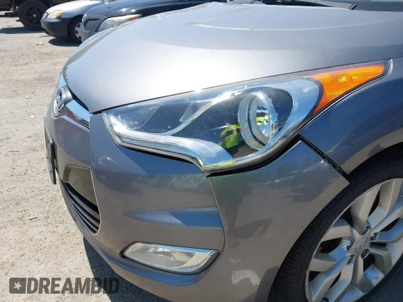 2012 Hyundai Veloster w/Black Int with VIN KMHTC6AD5CU030788, listed as a IAAI auction lot 42774337 with 104,297 mi miles and . Bid and sale history available at DreamBid. Image 6.