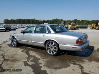 2000 Jaguar XJ with VIN SAJDA14C9YLF17465, listed as a Copart auction lot 75537214 with 115,918 mi miles and Salvage Title. Bid and sale history available at carsss.com. Image 2.