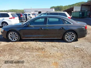 2011 Audi A8 with VIN WAURVAFDXBN014290, listed as a IAAI auction lot 40860777 with 152,584 mi miles and . Bid and sale history available at DreamBid. Image 14.
