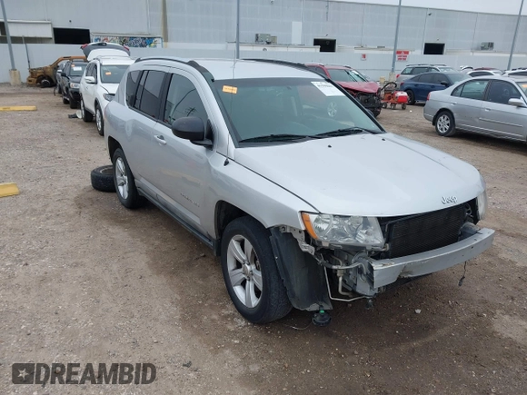 2011 Jeep Compass with VIN 1J4NT1FA7BD142600, listed as a IAAI auction lot 41590661 with 266,600 mi miles. Bid and sale history available at carsss.com. Image 1.