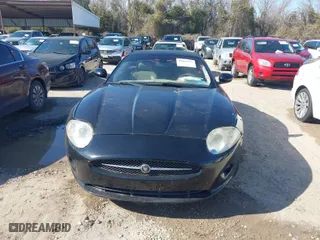 2007 Jaguar XK with VIN SAJDA44B975B01444, listed as a IAAI auction lot 41606094 with 155,227 mi miles. Bid and sale history available at carsss.com. Image 12.
