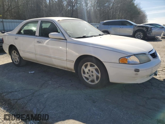 2001 Mazda 626 LX z VIN 1YVGF22C815240640, wystawiony jako Copart lot #47609315 z przebiegiem Nie podano mil oraz Szkoda całkowita • Salvage title. Historia ofert i sprzedaży dostępna na DreamBid. Obrazek 4.