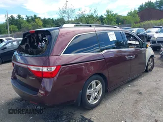 2012 Honda Odyssey Touring z VIN 5FNRL5H95CB040384, wystawiony jako IAAI lot #42751342 z przebiegiem 176 222 mil mil oraz . Historia ofert i sprzedaży dostępna na DreamBid. Obrazek 4.