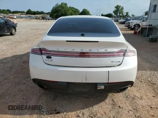 2014 Lincoln MKZ z VIN 3LN6L2G90ER820731, wystawiony jako Copart lot #57818185 z przebiegiem 133 133 mil mil oraz Szkoda całkowita • Salvage title. Historia ofert i sprzedaży dostępna na DreamBid. Obrazek 6.