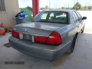 2001 Mercury Grand Marquis GS z VIN 2MEFM74W41X702619, wystawiony jako IAAI lot #42323749 z przebiegiem 124 748 mil mil oraz . Historia ofert i sprzedaży dostępna na DreamBid. Obrazek 4.