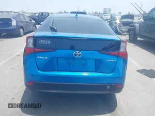 2021 Toyota Prius L Eco with VIN JTDKAMFUXM3134462, listed as a IAAI auction lot 42450931 with 89,239 mi miles and . Bid and sale history available at DreamBid. Image 16.