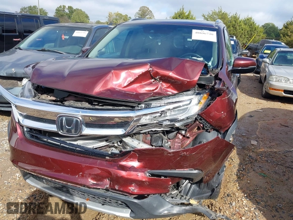 2020 Honda Pilot Touring 8-Passenger with VIN 5FNYF5H94LB012062, listed as a IAAI auction lot 40806740 with 115,431 mi miles and . Bid and sale history available at DreamBid. Image 6.