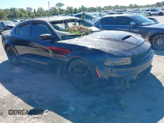 2022 Dodge Charger Scat Pack Widebody with VIN 2C3CDXGJ4NH121940, listed as a IAAI auction lot 37847895 with 7,493 mi miles and . Bid and sale history available at carsss.com. Image 1.