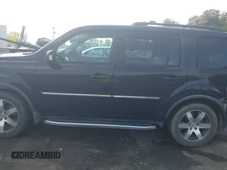 2012 Honda Pilot Touring with VIN 5FNYF4H95CB026191, listed as a IAAI auction lot 42021987 with 229,273 mi miles and . Bid and sale history available at DreamBid. Image 14.