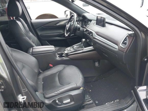 2016 Mazda CX-9 Grand Touring with VIN JM3TCBDY1G0103560, listed as a IAAI auction lot 41344813 with 123,588 mi miles and . Bid and sale history available at DreamBid. Image 5.