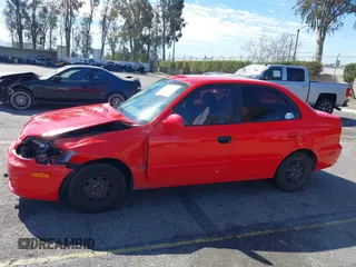 2003 Hyundai Accent GL with VIN KMHCG45C93U487209, listed as a IAAI auction lot 41590636 with 118,811 mi miles. Bid and sale history available at carsss.com. Image 14.